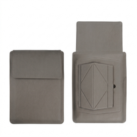 Grey laptop sleeve with built-in stand, front flap closed and raised