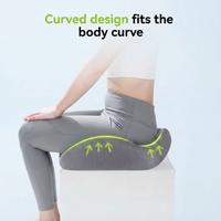 Gray curved memory foam seat cushion on chair for leg support