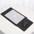 Black laptop sleeve with integrated mouse area, laptop resting on top
