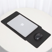 Black laptop sleeve with integrated mouse area, laptop resting on top